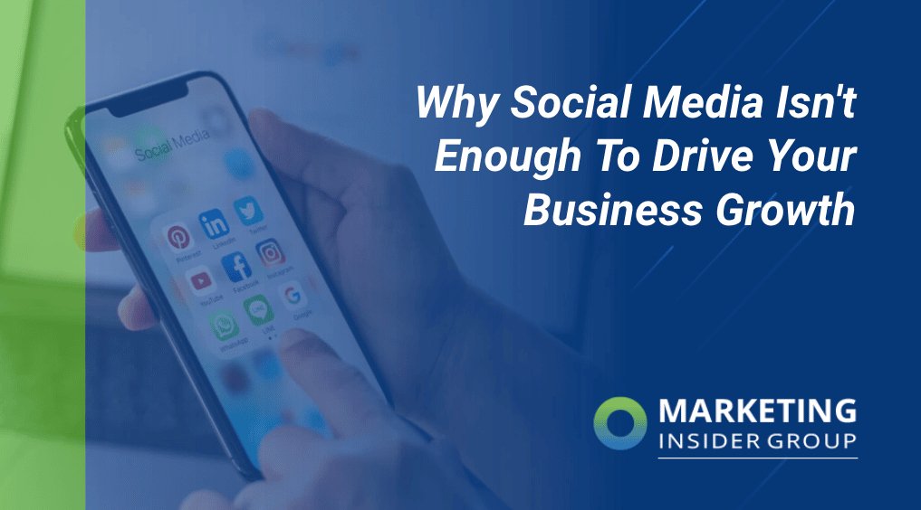 man holding phone with social media on it to show social media isnt enough to bring business